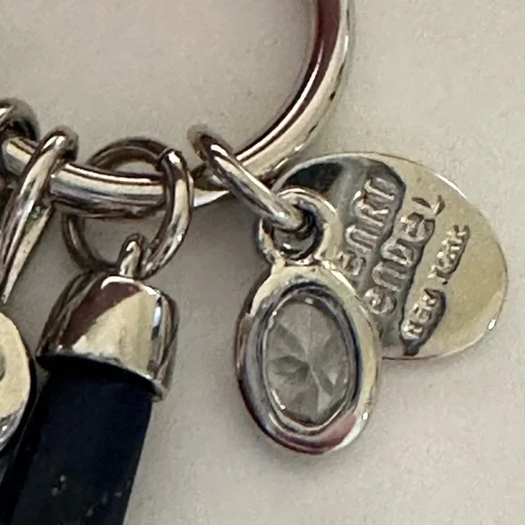 Henri Bendel  silver tone necklace with dark blue crystal and logo charms disc - Picture 5 of 9